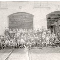 Employees In Front of Train Station Building